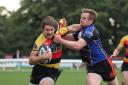 Out of my way: Cinderford's Steffan Hawley struggles to get to grips with Richmond winger Will Browne