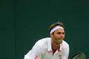 Determined: Ross Hutchins' return to action at Wimbledon was short-lived, but he remains confident his form will return