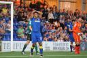 Frustration: Lyle Taylor feels the pain of AFC Wimbledon's defeat to Scunthorpe United