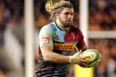 On the charge: Director of rugby John Kingston is surprised Quins openside Luke Wallace has not been called on to make his mark with England