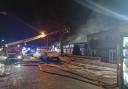 12 fire engines called to the scene of a fire in an industrial unit in Sutton.
