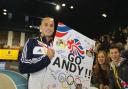 Support: Andy Turner holds up a fan made poster at a meeting in Glasgow earlier this year. Picture: Steven Paston