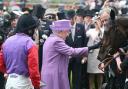 Queen Elizabeth II pats her horse Estimate after it won the 2013 Gold Cup ridden by jockey Ryan Moore
