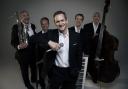 Alexander Armstrong and his band