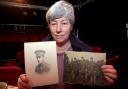 Rosemary Lever with pictures of her grandfather Robert Law