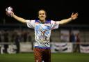 Suits you: Jamie Byatt celebrates his hat-trick by showing off the shirt he was given by children during Corinthian Casuals' historic tour to Sao Paulo in Brazil earlier this year