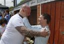 Come 'ere, big fella: Former Walton Casuals coach Neil Hams greets an old friend during his benefit day at Waterside Drive on Sunday
