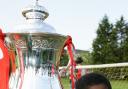 One for the future: Former Met Police youngster Tane Caubo pictured with the FA Cup as a nine-year-old