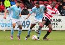 Goal man: Nicke Kabamba, centre, is among a host of Hampton stars thinking of the prospect of National League South football next term