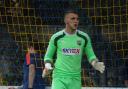 Man in demand: Goalkeeper Mark Smith was released from Brentford this week and could switch to Hampton