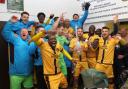 Sutton United players and staff celebrate beating Cheltenham Town in the FA Cup Second Round. Photo: Paul Loughlin