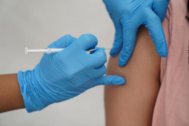 Woman given Covid-19 vaccine