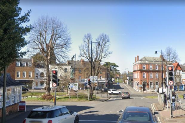 The victims were assaulted at the traffic lights on Claremont Lane's junction with Esher High Street.