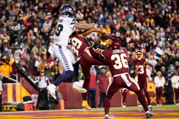 Washington cornerback Kendall Fuller (29) intercepts a pass in the end zone intended for Seattle Seahawks wide receiver Freddie Swain (18)