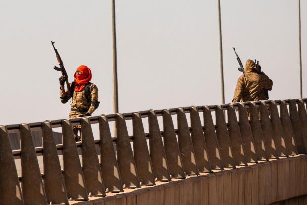 A mutinous soldier fires into the air at the Bobo interchange, near the Lamizana camp in Burkina Faso’s capital Ouagadougou