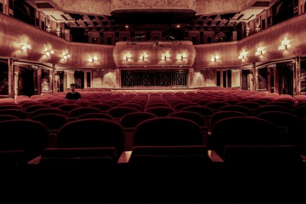Your Local Guardian: Rows of empty red theatre seats. Credit: Canva