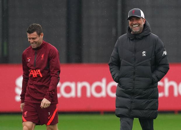Your Local Guardian: Liverpool manager Jurgen Klopp (right) and James Milner in discussion during a training session at the AXA Training Centre, Kirkby. 