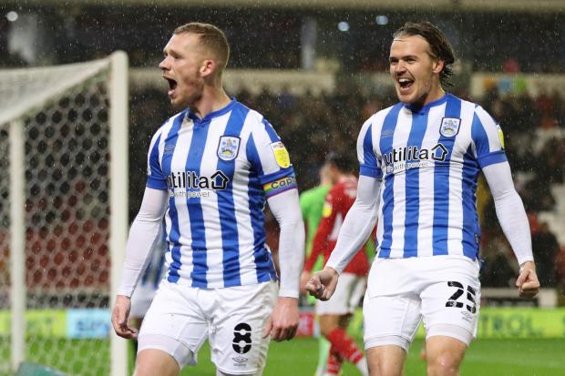 Huddersfield Town's Lewis O'Brien (left) has been linked with a move to Crystal Palace