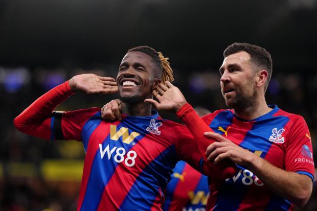 Crystal Palace's Wilfried Zaha celebrates scoring his sides third goal during the Premier League match at Vicarage Road, Watford