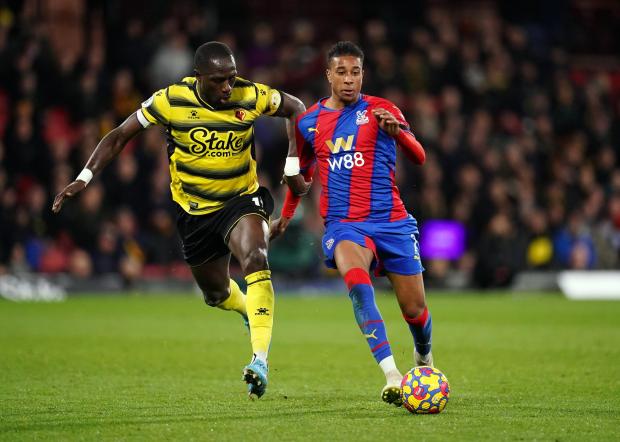 Your Local Guardian: Watford's Moussa Sissoko (left) and Crystal Palace's Michael Olise battle for the ball during the Premier League match at Vicarage Road, Watford.