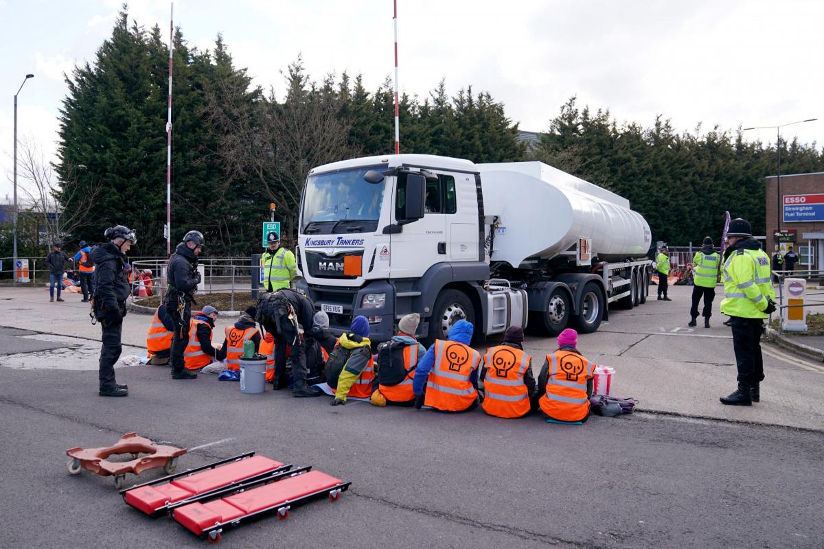 Activists from Just Stop Oil block the route of a tanker as they blockade the ESSO Birmingham (images: PA MEDIA)