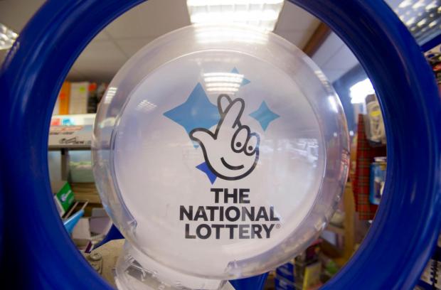 Your Local Guardian: National lottery logo. Credit: PA