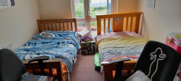 Your Local Guardian: The slightly larger bedroom that the couple have given up to the children
