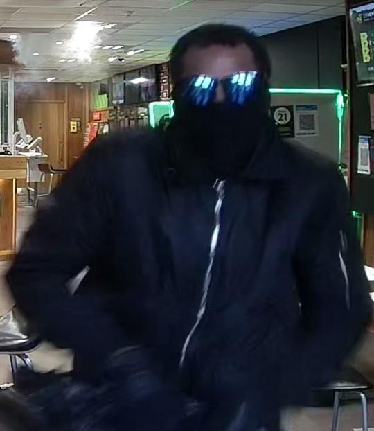 Your Local Guardian: A man is wanted after an armed robbery in a betting shop in Croydon (Image: Met Police) 