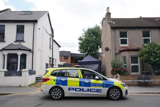 Your Local Guardian: Police outside a property on Derby Road as the search continues for student nurse Owami Davies, 24, who has been missing for more than three weeks (