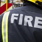 Four fire engines and 25 firefighters were called to a fire in Twickenham that damaged the roof and internal ducting of a building.