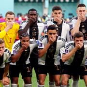 Musiala, in the middle at the front, with the German team as they covered their faces in protest against FIFA head of their opening World Cup match against Japan. Picture: PA
