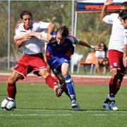 Sam Nicholson playing for Ventura Fusion against Michael Brown and Hayden Mullens from Portsmouth FC in California.