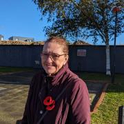Paula thinks the old demolished site of Victoria House behind her is an 'eyesore' (Credit: Harrison Galliven/LDRS)