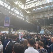 People to board train at London's Waterloo station