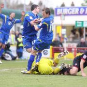 In a tangle: Billy Knott and Jack Midson cannot find an equaliser against Rotherham