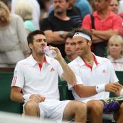 Home sweet home: Wimbledon's Ross Hutchins, right, with doubles partner Colin Fleming at SW19 last week