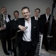 Alexander Armstrong and his band