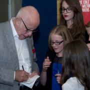 Richard Wilson, who played Victor Meldrew in One Foot in the Grave, signs autographs for fans at the Rose Theatre