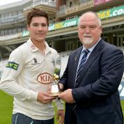 Come a long way: Banstead CC’s Rory Burns collects the breakthrough player of the year award from Mike Gatting after a season opening the Surrey CCC batting
