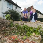 Graeme Carter with his children Olivia and Alfie and Cheam Councillor Mary Burstow
