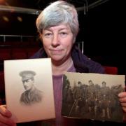Rosemary Lever with pictures of her grandfather Robert Law