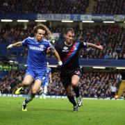 Hero or villain: David Luiz in his Chelsea days does battle with Crystal Palace striker Marouane Chamakh