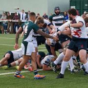 Him again: Scottish number eight Mark Bright, centre, adds another try to his collection at Ealing