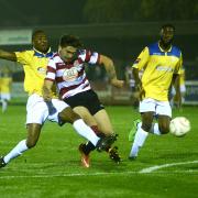 Good show: George Oakley in action for Kingstonian against Enfield Town before limping off with a hamstring problem