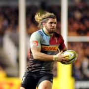 On the charge: Director of rugby John Kingston is surprised Quins openside Luke Wallace has not been called on to make his mark with England