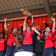 Greatest day: Hampton skipper Kieran Murphy lifts the Ryman Premier League trophy at the Beveree on Saturday
