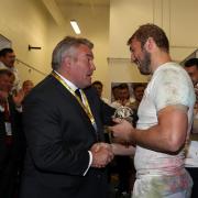 Honoured: Chris Robshaw gets a commemorative 50th England cap from fellow Quins and England hero Jason Leonard after Saturday's win