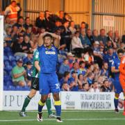 Frustration: Lyle Taylor feels the pain of AFC Wimbledon's defeat to Scunthorpe United