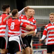 Opening things up: Defender Sam Page scored Kingstonian's first goal on Sunday