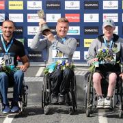 David Weir (centre) celebrates winning the Wheelchair Elite race during the 2018 Simply Health Great North Run. Photo: Richard Sellers / PA